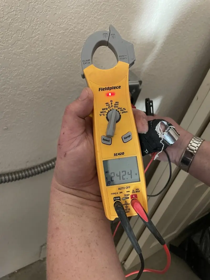 Voltage testing with clamp meter during Whole House Surge Protector in Marion